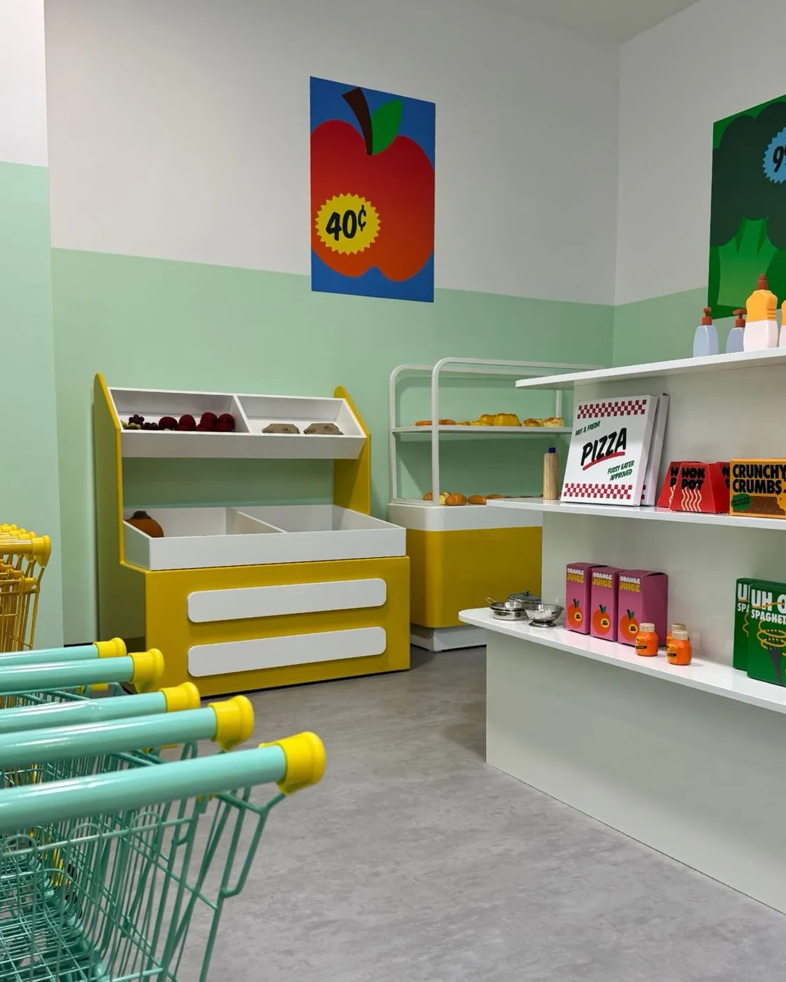 The Supermarket room with trolleys and stocked shelves